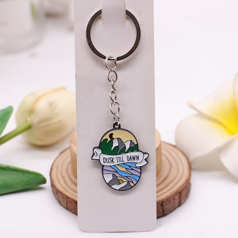Mountain Badge alloy illustrated bag charm; bag not included