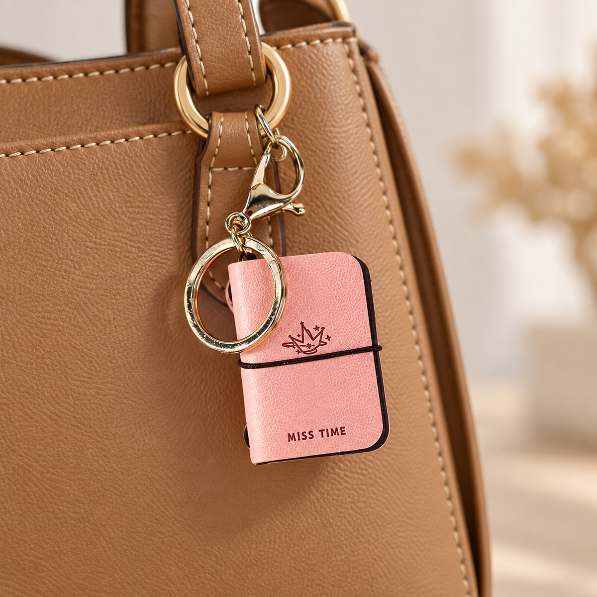Bag charm styled on a bag; bag not included