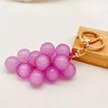 One translucent purple grape charm with gold-tone clasp and keyring from the set of five