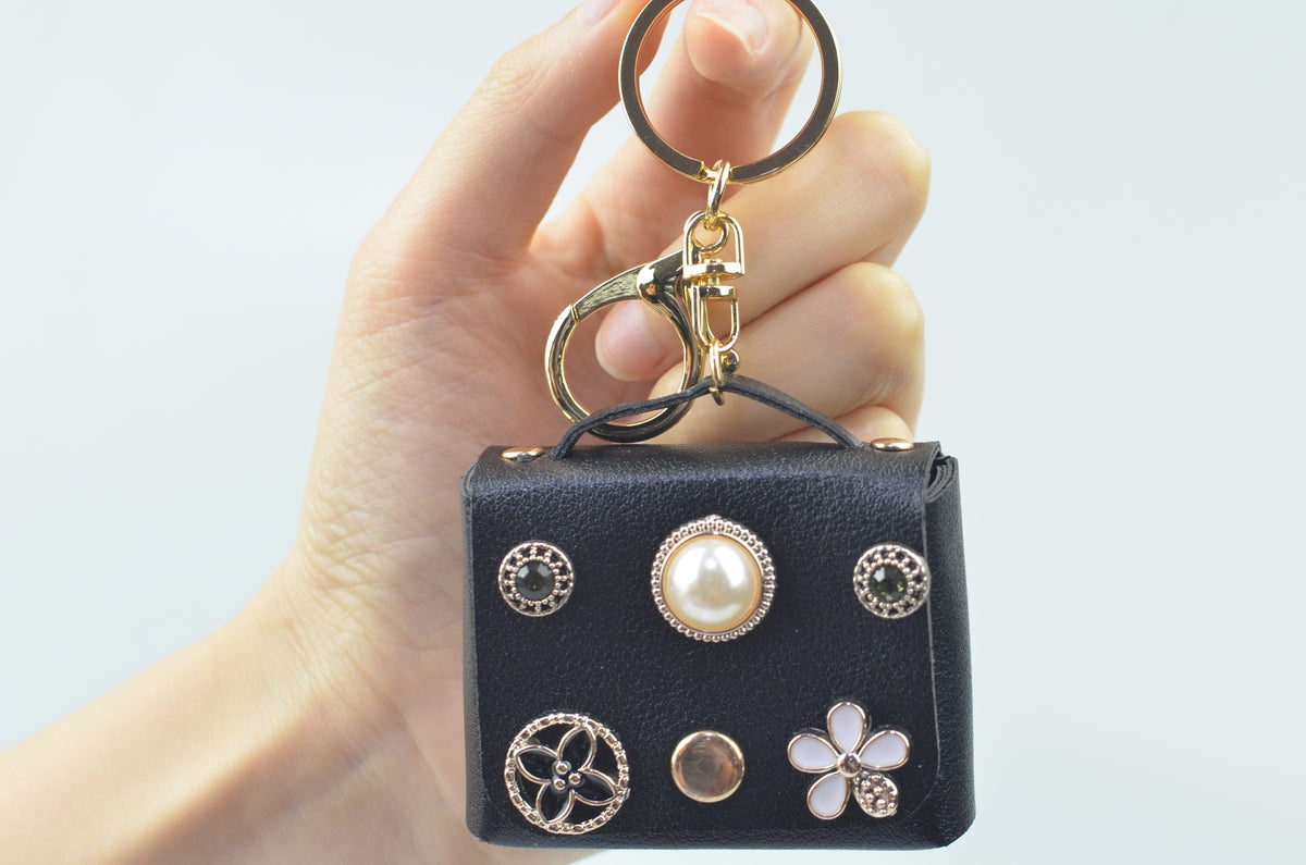 Mini handbag-shaped bag charm — Black