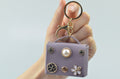 Mini handbag-shaped bag charm — Purple