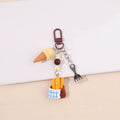 Ice cream and baguette basket bag charm with blue-and-white cloth detail; supplier product photo
