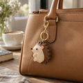 PU hedgehog bag charm attached to a handbag