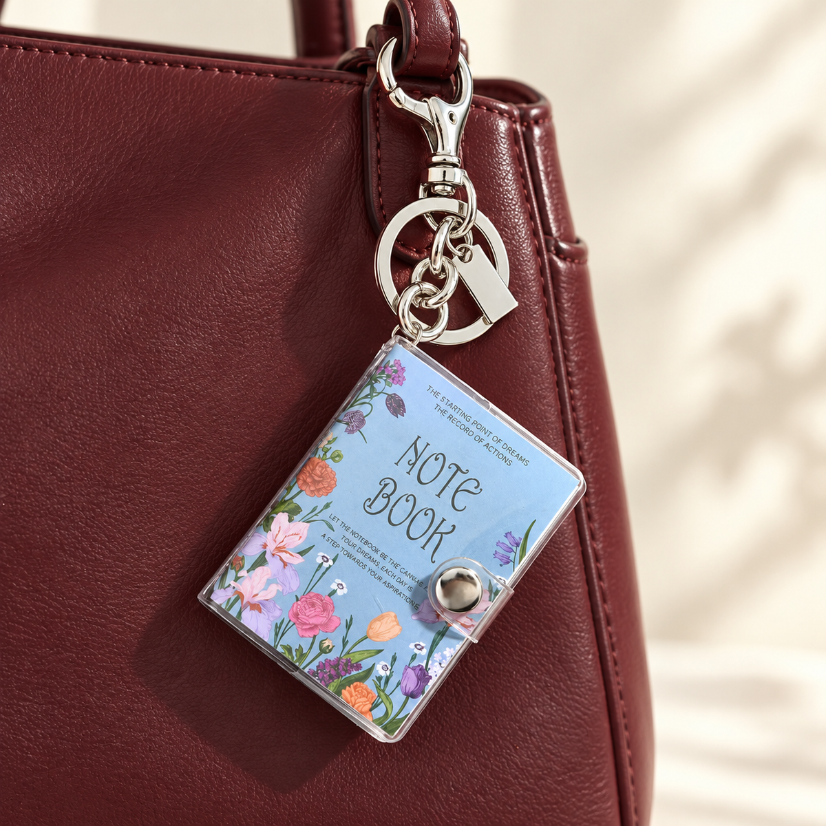 Mini Notebook Bag Charm styled on a bag; bag not included