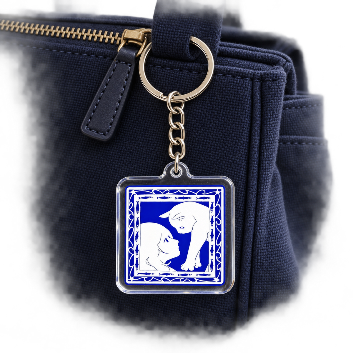 Woman & Cat Blue Acrylic Bag Charm styled on a bag; bag not included