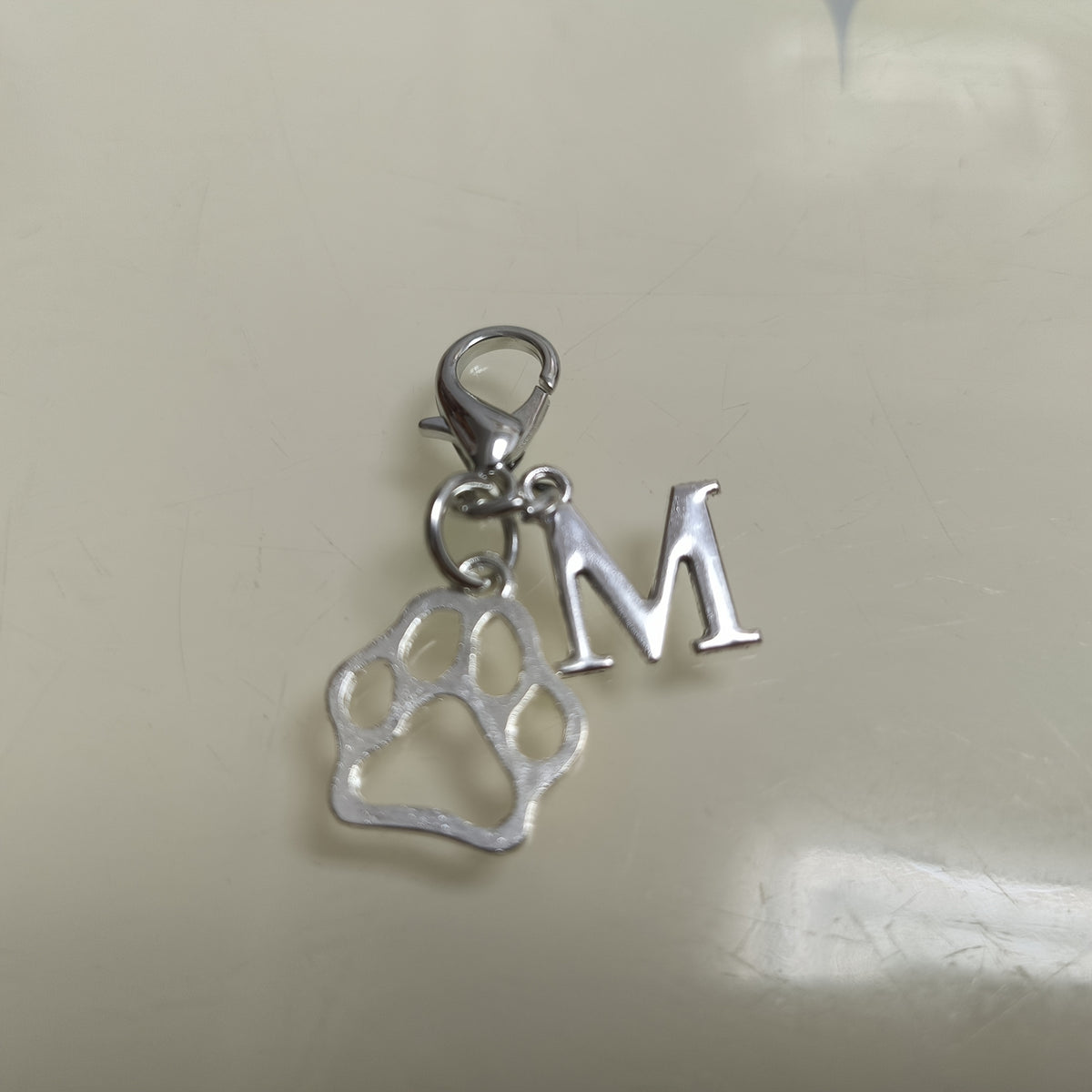 Paw & Initial Bag Charm — supplier detail