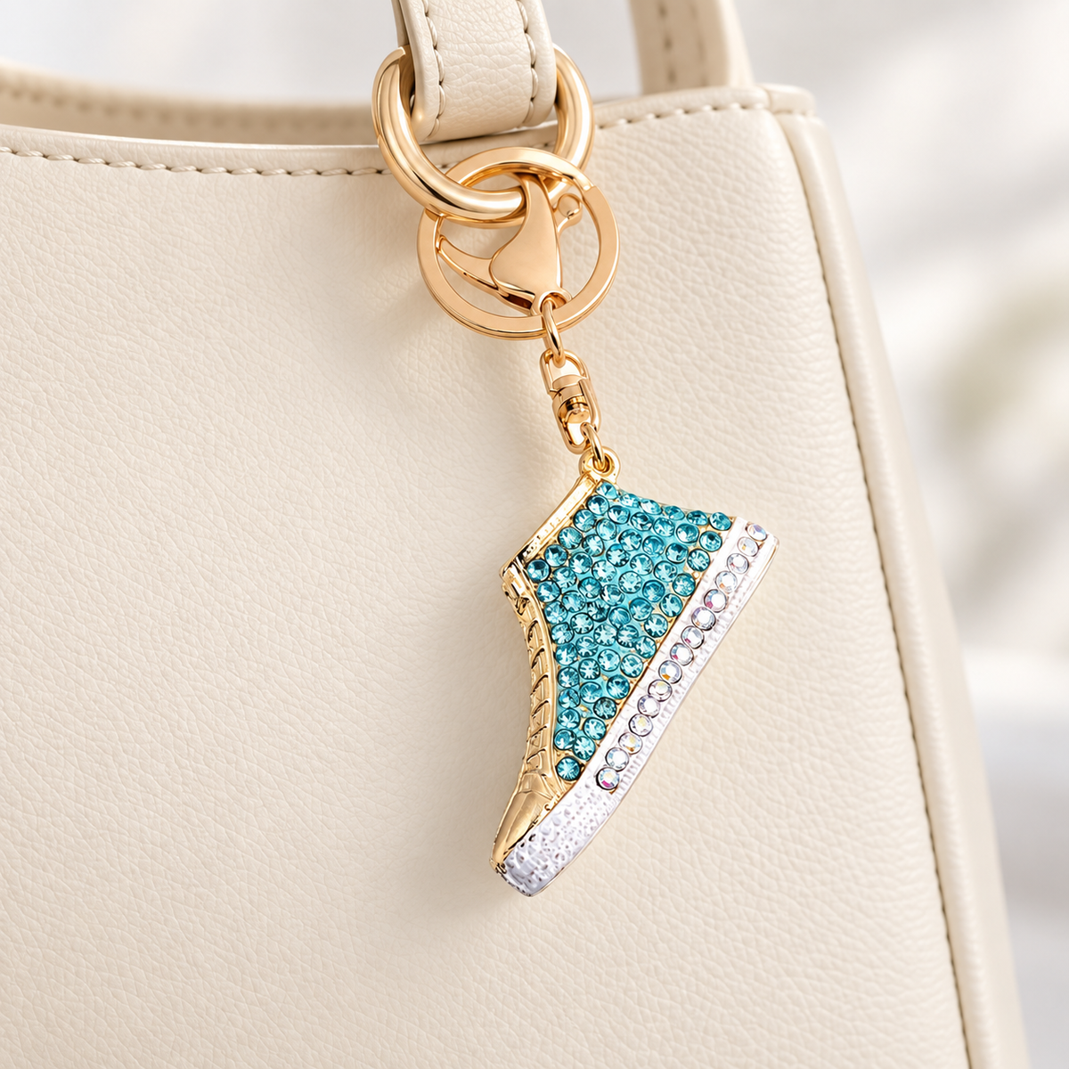 Rhinestone Sneaker Bag Charm styled on a cream handbag; bag not included