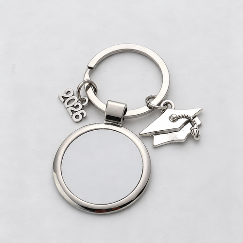 Silver-tone 2026 graduation charm with blank round printing panel and cap; front view