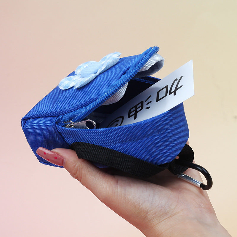 Daisy mini backpack pouch with zipper open showing the interior — Blue; display insert not included