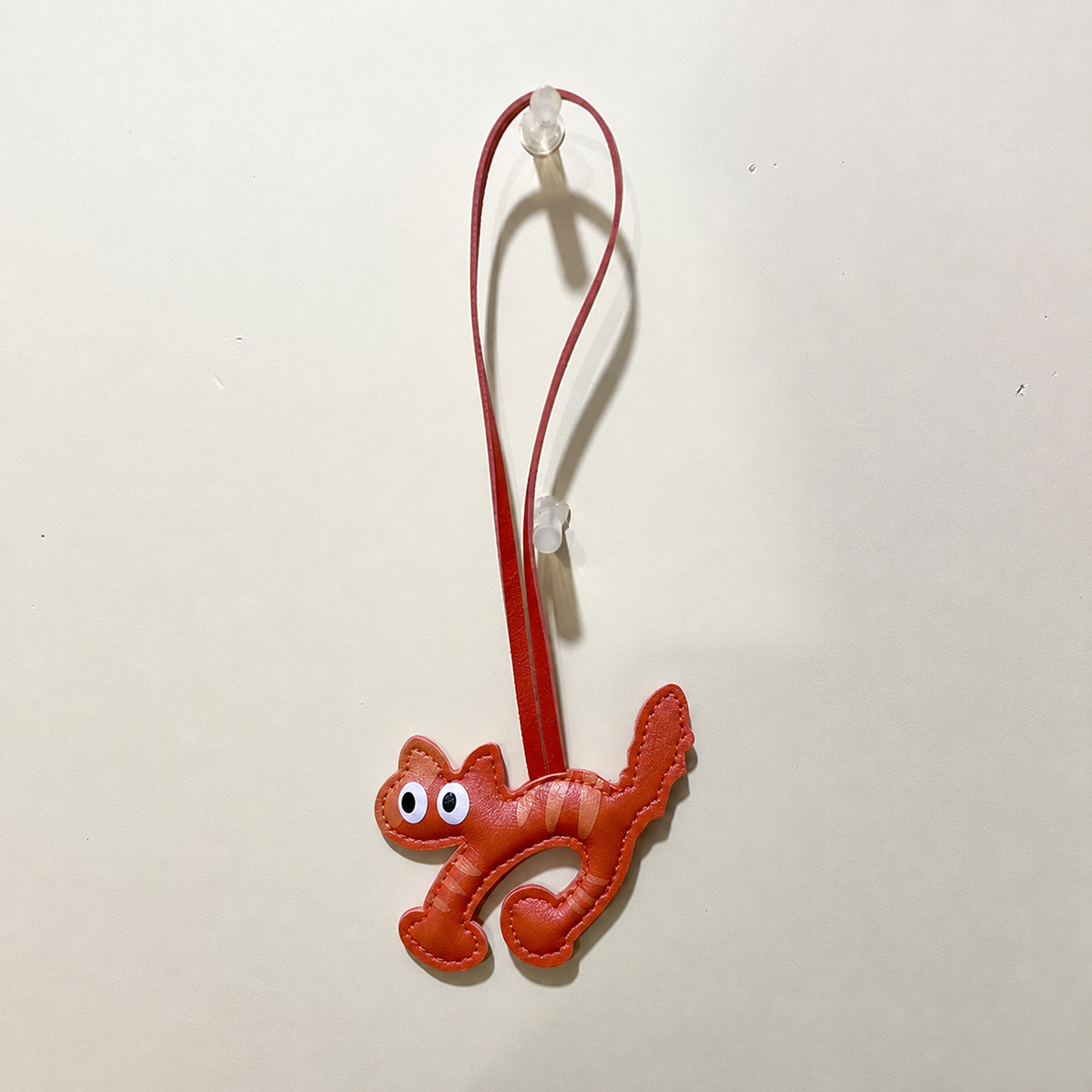 Cat silhouette bag charm — Orange Striped Cat; exact source design and loop attachment