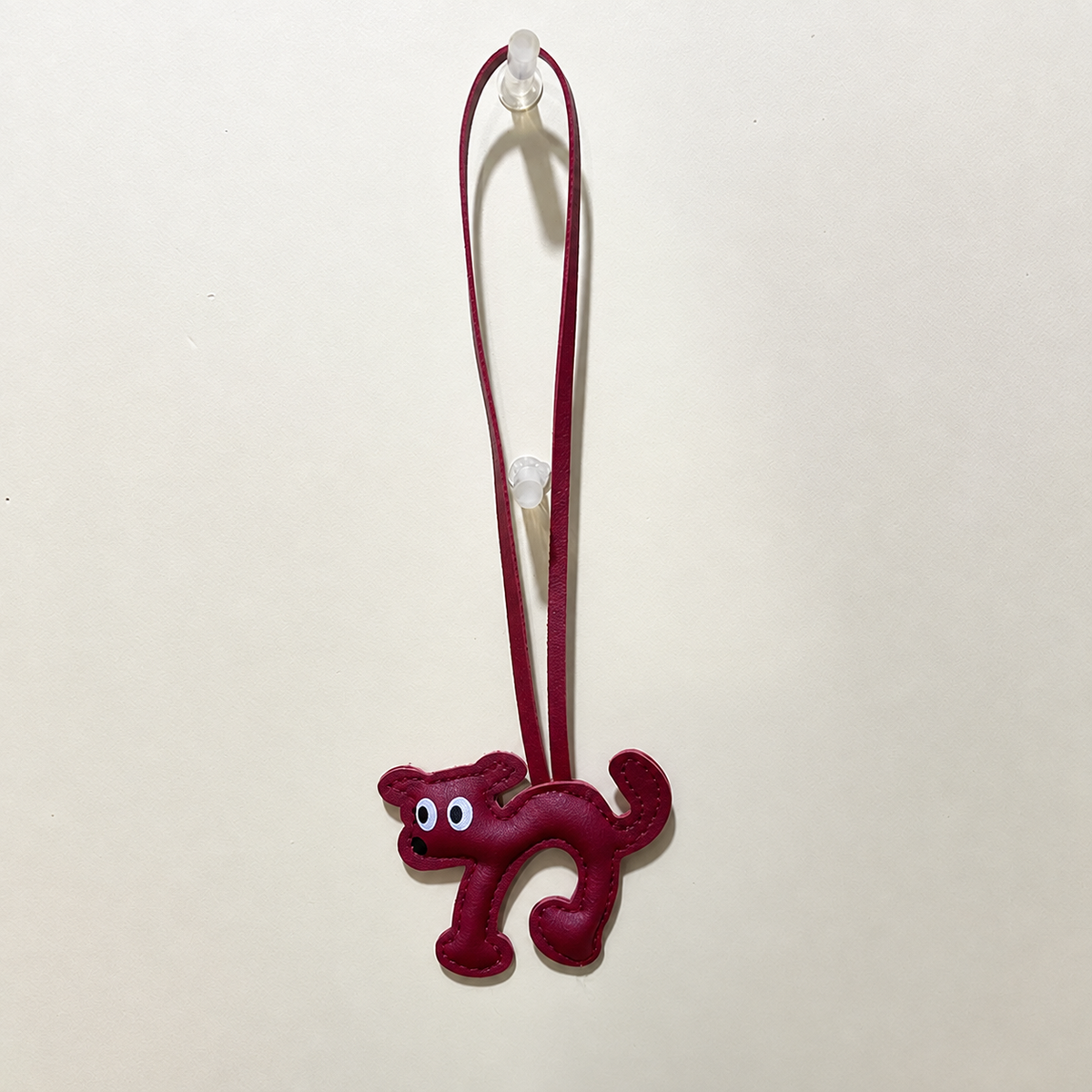 Cat silhouette bag charm — Burgundy Cat; exact source design and loop attachment