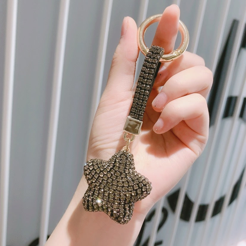 Black rhinestone star and matching strap with gold-tone keyring — supplier detail photo