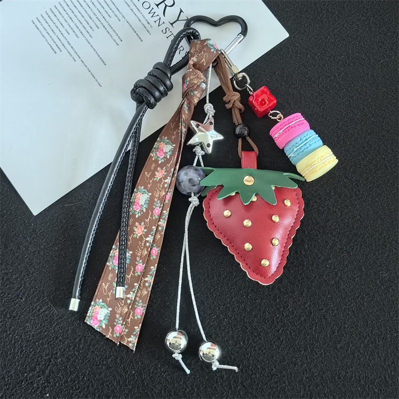 Red PU strawberry and floral ribbon bag charm with black heart clip — one complete charm
