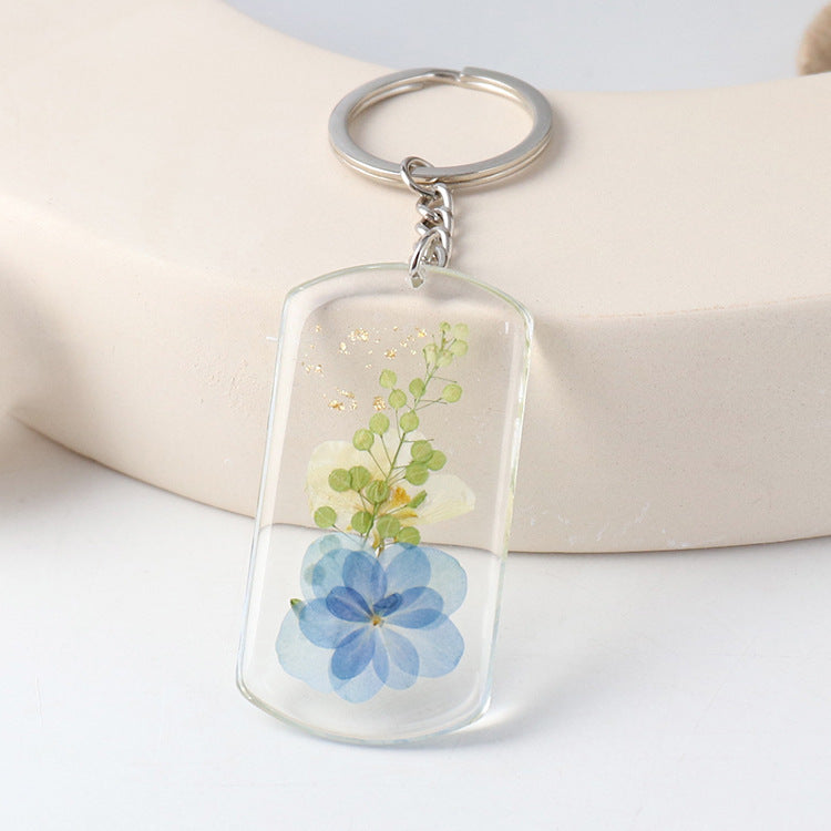 Blue pressed-flower charm detail