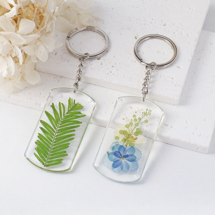 Green fern and blue flower botanical charms
