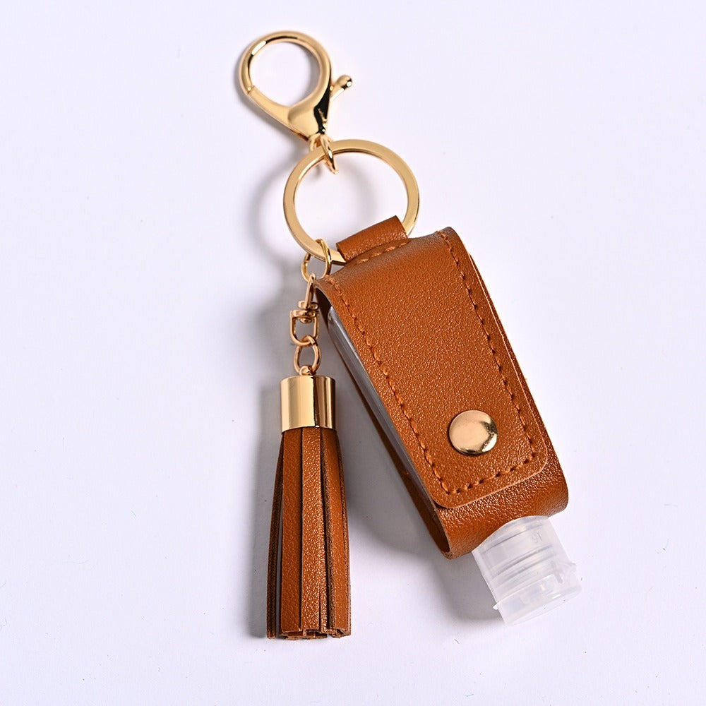 Tassel sanitizer bottle holder — Tan