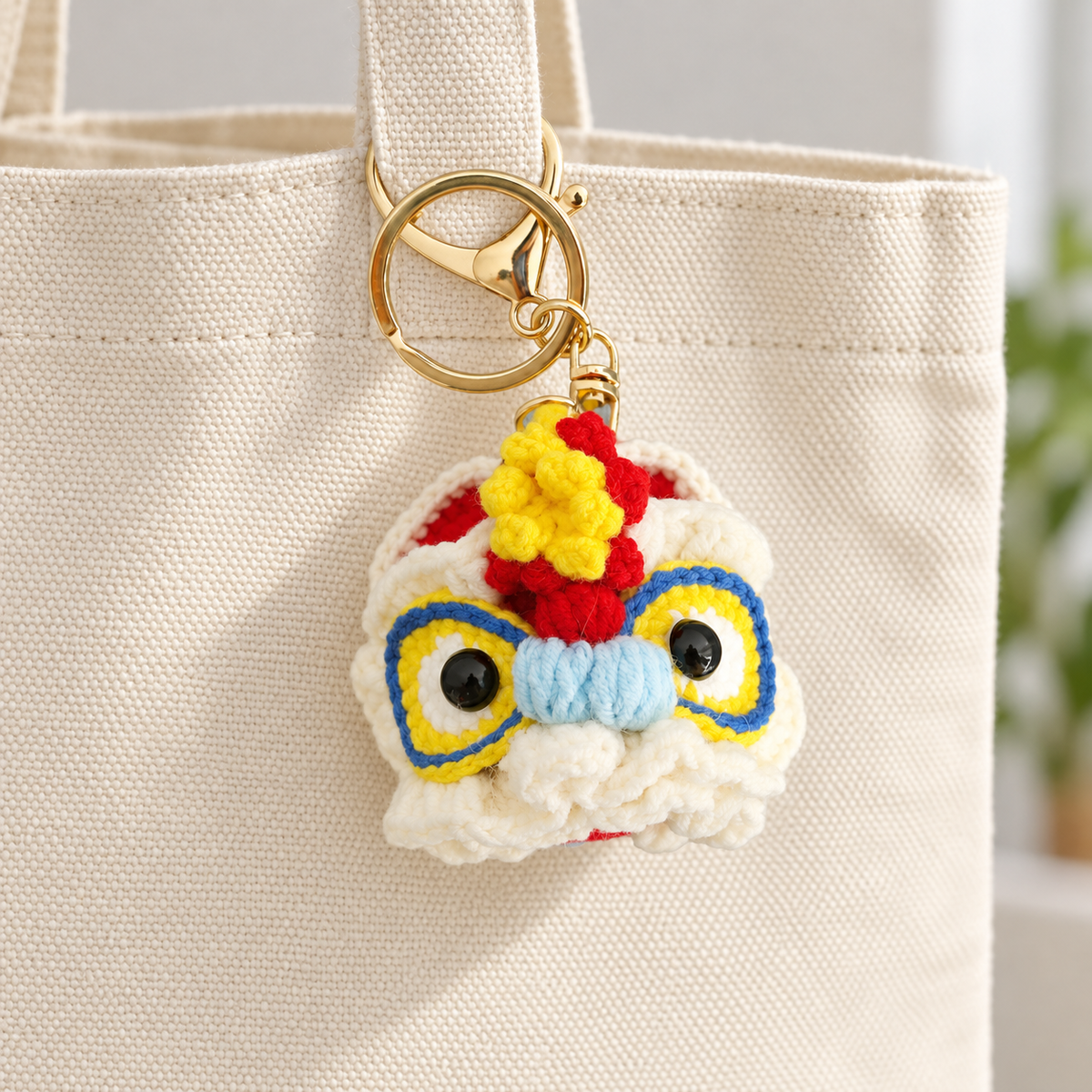 Crochet Lion Dance Bag Charm on a canvas bag; bag not included