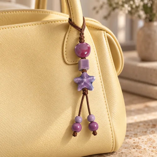 Pastel Ceramic Bead Bag Charm styled on a handbag