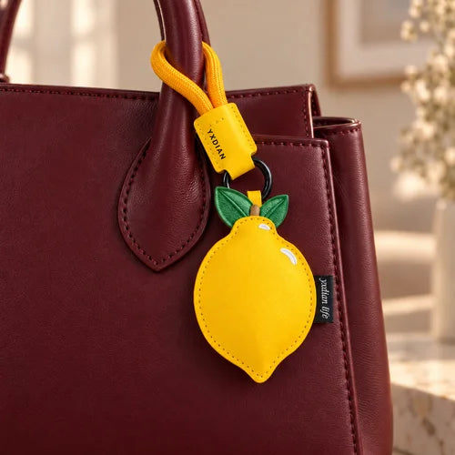 Lemon & Peach Bag Charm Duo styled on a handbag