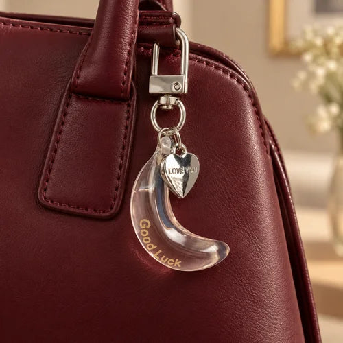 Clear Banana Charm Trio styled on a handbag