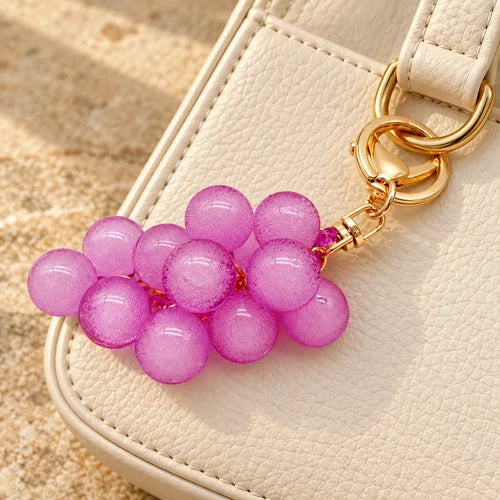 Purple Grape Charm Set of 5 styled on a handbag